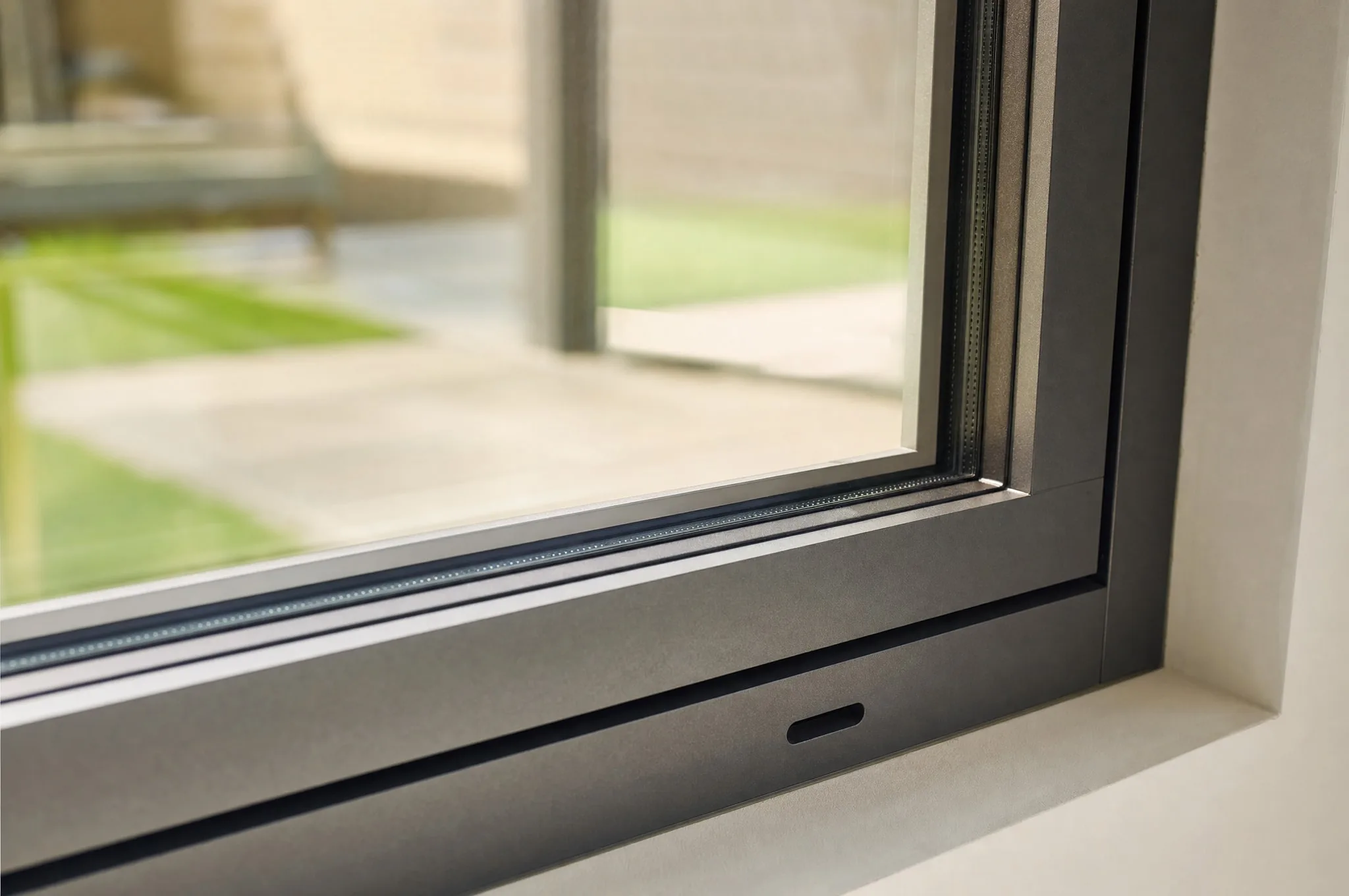 alu frame with visible drains · clear glazing